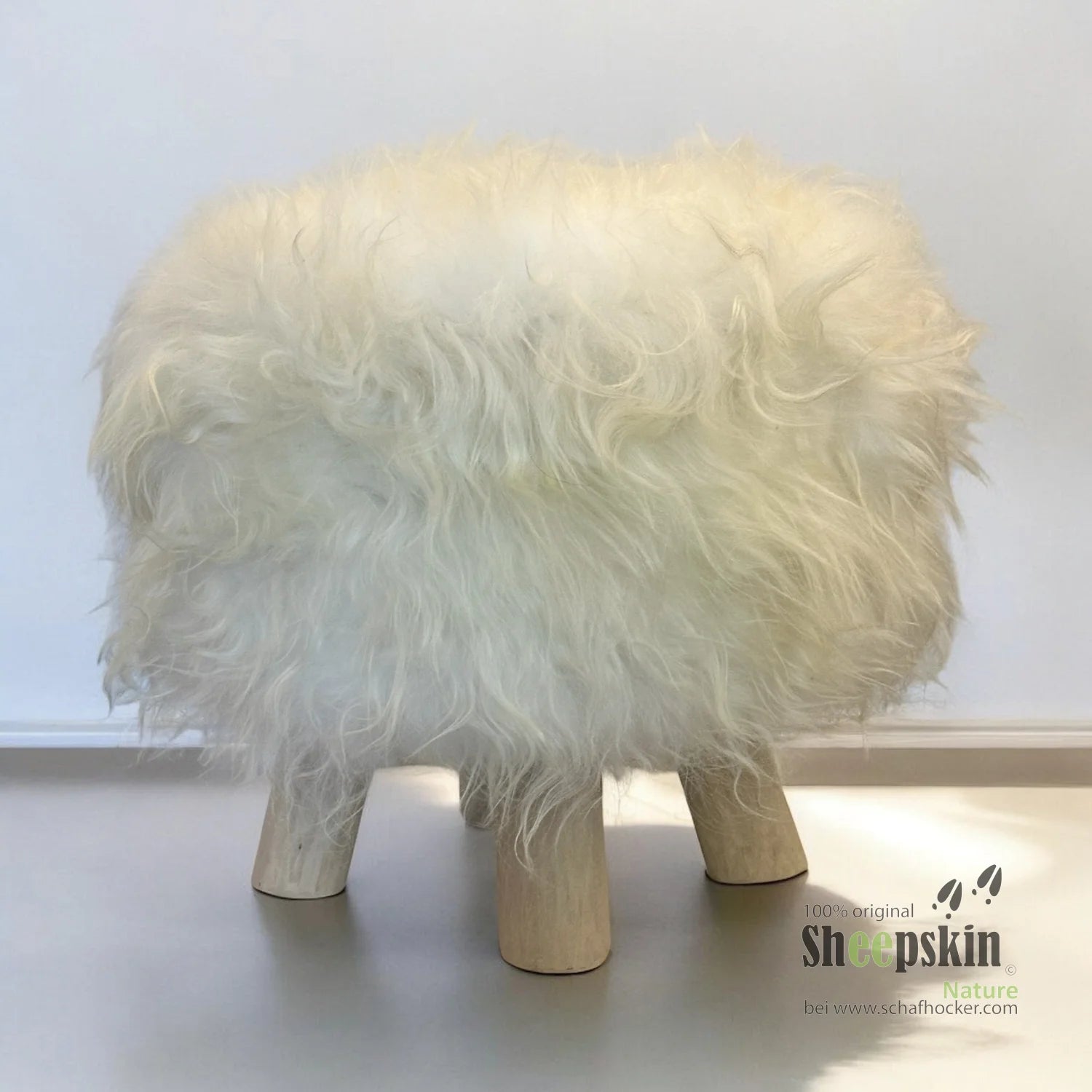 Designer Chalet Fellhocker rund ’eisbärweiß’ Fellhocker